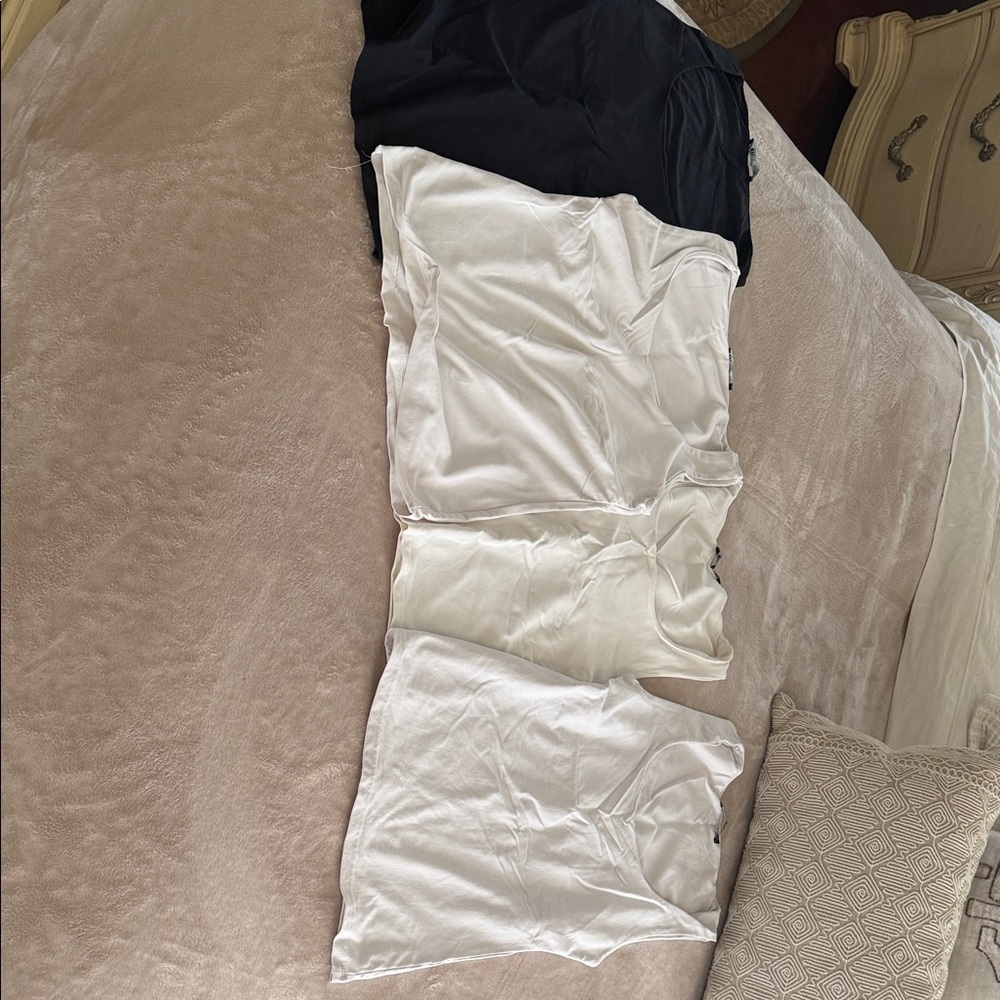 Chic Zara tank shirts Includes 1 black and 3 off white pieces. Soft fabric